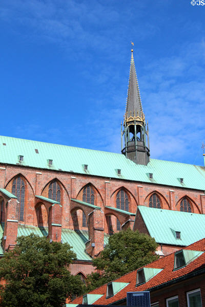 Flamboyant central spire & brick flying buttresses of St Mary's Church. Lübeck, Germany.