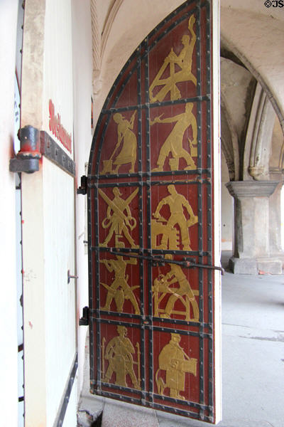 Door with art representing manual professions of town in main building at Lübeck Rathaus. Lübeck, Germany.