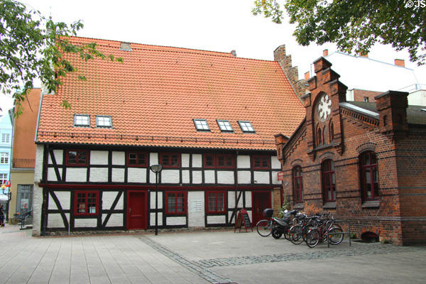Heritage brick building at corner of Marienkirche. Rostock, Germany.