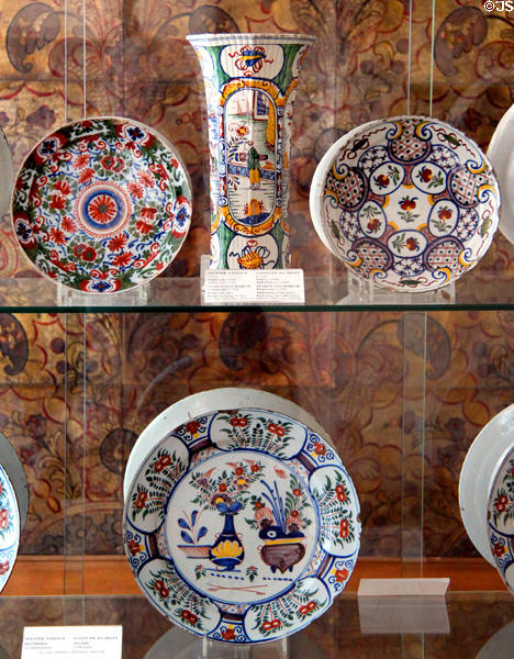 Delft faience flower vase & plates (18thC) at Schleswig Holstein State Museum. Schleswig, Germany.