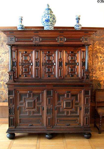Oak & ebony chest on chest (17thC) supporting Delft faience vases at Schleswig Holstein State Museum. Schleswig, Germany.