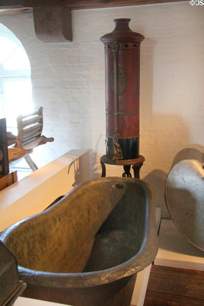 Antique bathtub & water heater at Schleswig Holstein State Museum. Schleswig, Germany.