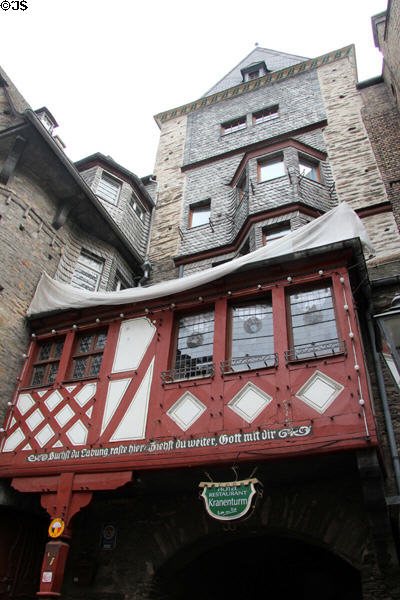 Vintage building with saying in German Gothic script painted on facade. Bacharach, Germany.