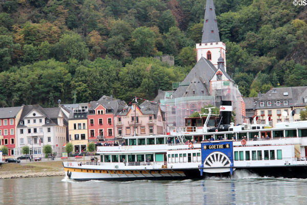 Sightseeing boat with St. Goar in the background. St. Goar, Germany.