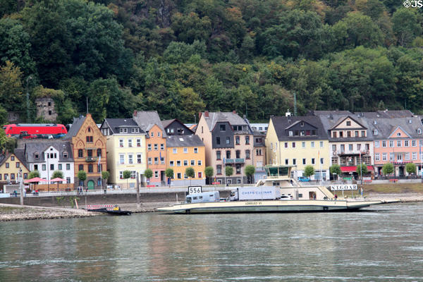 St Goar with a Rhine River barge passing by. St. Goar, Germany.
