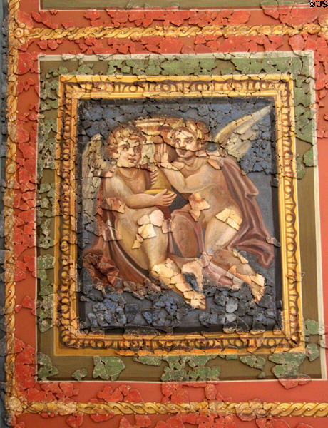 11. Roman ceiling fresco (4thC) section depicting pair of cupids with censer bowl at Cathedral Museum. Trier, Germany.
