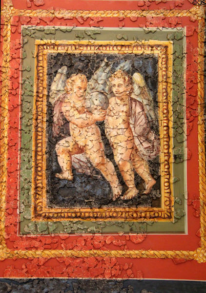 15. Roman ceiling fresco (4thC) section depicting pair of cupids with silver globe at Cathedral Museum. Trier, Germany.