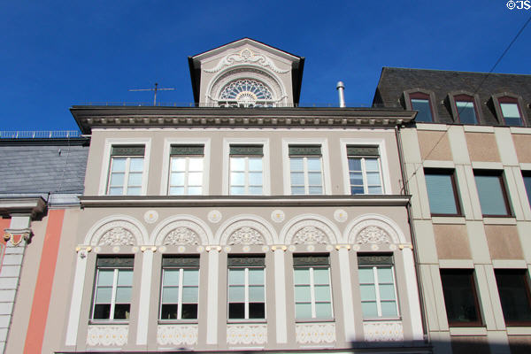 Neoclassical building with ornate roof dormer on Simeonstr. Trier, Germany.