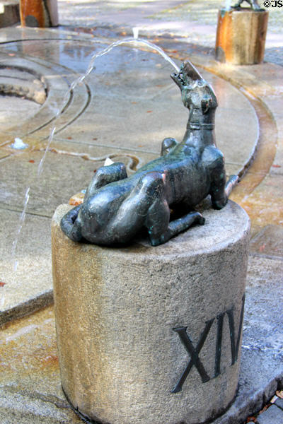 Dog marking the hour in Water Clock Fountain beside Red Tower. Trier, Germany.
