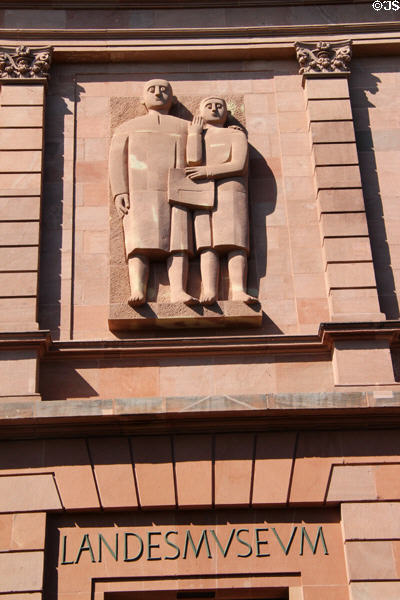 Human figures above entrance to Trier Archaeological Museum. Trier, Germany.