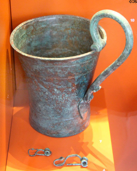 Bronze cup & clasp pins (4thC BCE) found in girl's grave at Trier Archaeological Museum. Trier, Germany.