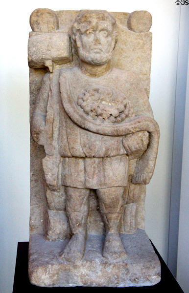 Gallo-Roman sandstone figurine of bearded patron god (end 3rdC) at Trier Archaeological Museum. Trier, Germany.