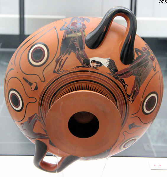 Outside of Greek terracotta black-figure drinking cup with Dionysus showing warriors (c540-530 BCE) at Antikensammlungen. Munich, Germany.