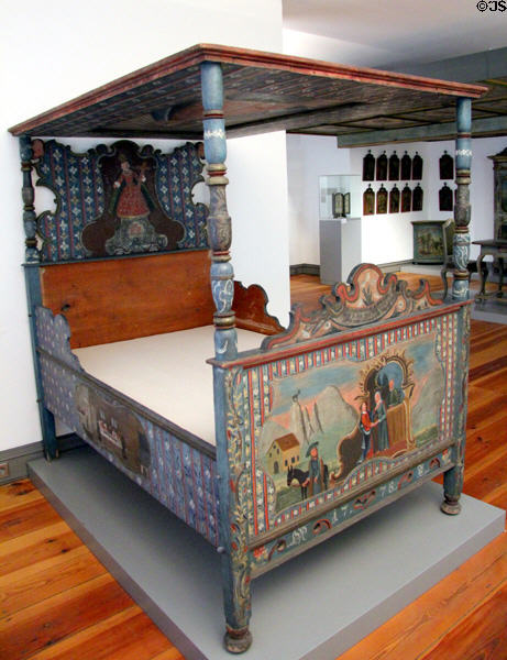 Bavarian baroque painted four-poster bed (Himmelbett where one looks up at heaven) (1778) by Johann Nepomuk Bichler from Schliersee at Bavarian National Museum. Munich, Germany.