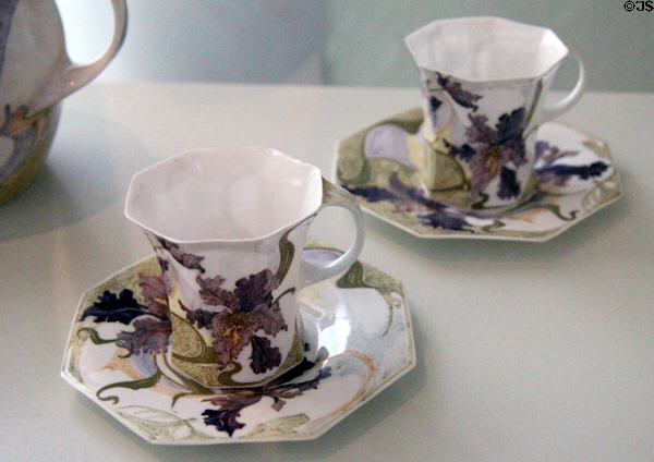 Porcelain cups & saucers painted with orchids (1904-5) by J. Jurriaan Kok & Samuel Schellink for Hague Plateelbakkerij Rozenburg at Bavarian National Museum. Munich, Germany.
