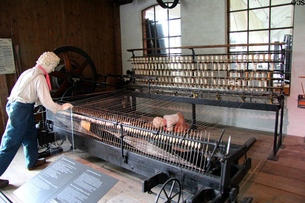 Semiautomatic cotton yarn spinning frame (c1840) where half of machine moved on track but worker had to push it back to starting position at Deutsches Museum. Munich, Germany.