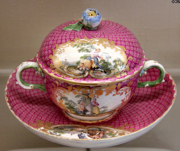Meissen porcelain small terrine with blue flower knob & country scenes framed with rococo purple mosaic scale decoration (c1745) at Meissen porcelain museum at Lustheim Palace. Munich, Germany.