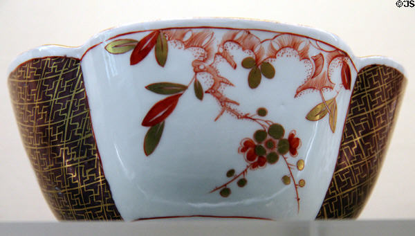 Meissen porcelain quatrefoil bowl (c1740) with gold net ornaments & flower branches based on Chinese model at Meissen porcelain museum at Lustheim Palace. Munich, Germany.