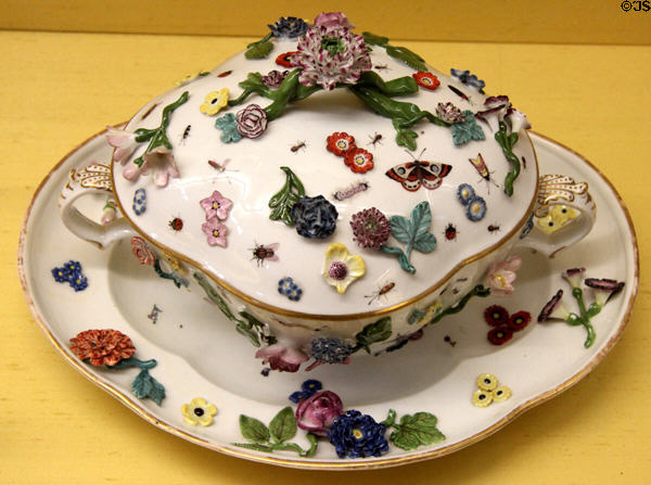 Meissen porcelain terrine & underplate (c1750) with relief decoration of flower & insects at Meissen porcelain museum at Lustheim Palace. Munich, Germany.