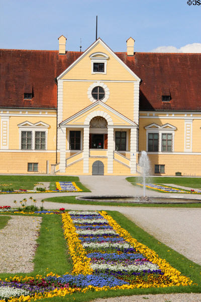 Portal to Old Schleißheim Palace over flower displays. Munich, Germany.