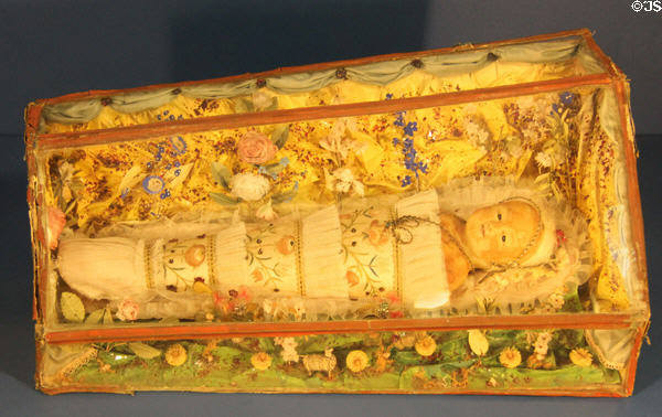 Swaddled baby Jesus figure from Switzerland at folk art Collection Gertrud Weinhold. Munich, Germany.
