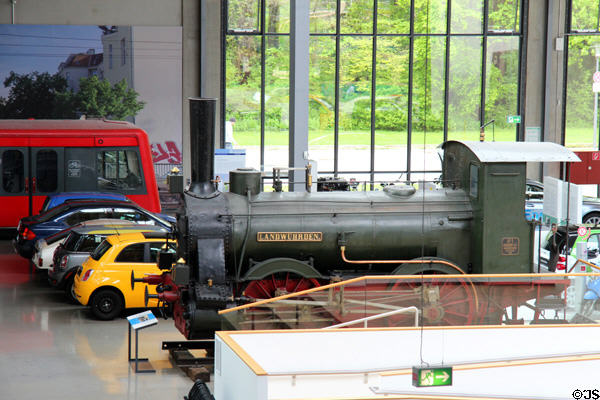 Landwührden passenger train steam locomotive (1867) parked among other transport vehicles at Deutsches Museum Transport Museum. Munich, Germany.