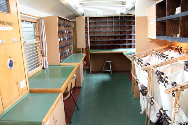 Interior of Postal wagon for passenger train for enroute sorting (1933) at Deutsches Museum Transport Museum. Munich, Germany.