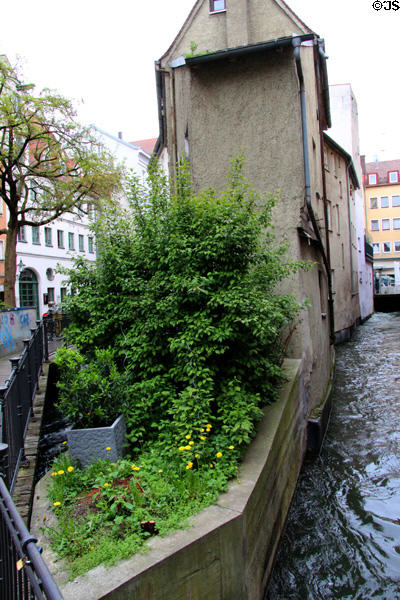 Lech canal running both sides of Brechthaus Museum. Augsburg, Germany.