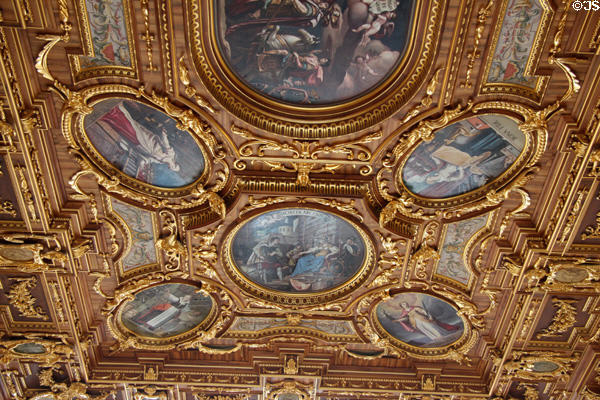 Paintings in gilded oval frames on ceiling in Goldener Saal at Augsburg Rathaus. Augsburg, Germany.