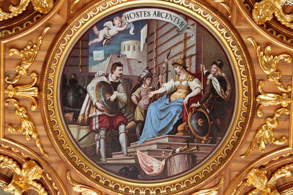 Circular ceiling painting titled Hostes Arcentur i.e. Enemies will be Repelled in Goldener Saal at Augsburg Rathaus. Augsburg, Germany.
