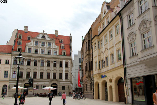 Fuggerplatz streetscape with Hans Jacob Fugger monument & Maximilian Museum. Augsburg, Germany.