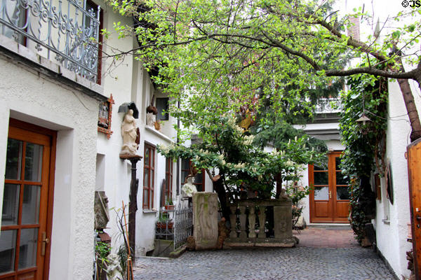 Patio surrounded by heritage buildings in older neighborhood. Augsburg, Germany.