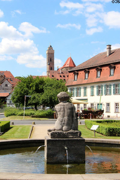 Sculpture in Geyerswörth rose garden with Frauenkirche spire beyond. Bamberg, Germany.