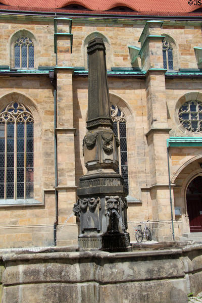 Obelisk fountain (1789) by Franz Peter Schuh beside City Church Bayreuth. Bayreuth, Germany.