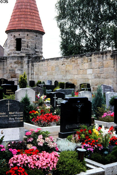 Church yard & graves at Effeltrich fortified church. Effeltrich, Germany.
