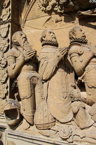 Sculpted praying knights & clergy with lace collars at Gößweinstein pilgrimage basilica. Gößweinstein, Germany.