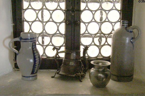 Stoneware & pewter vessels in leaded window at Albrecht Dürer's House. Nuremberg, Germany.