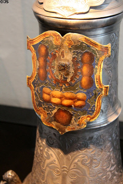 Detail of Baker's guild tin grinding flagon with spigot used for guild graduation of apprentices as journeymen (Schleifkanne) (1635) by Paulus Öham the Younger at Fembohaus City Museum. Nuremberg, Germany.