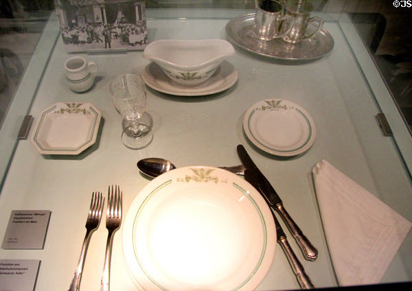 Porcelain place setting from rail station restaurant Schwarzer Adler (c1900) at Nuremberg Transport Museum. Nuremberg, Germany.