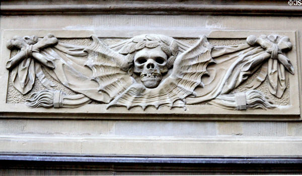 Death head detail, sometimes used as a reminder of the separation of the earth & the divine on Neumunster Collegiate Church. Würzburg, Germany.