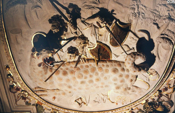 Ceiling plasterwork of St. Michael slaying dragon in Knights' Hall at Weikersheim Palace. Weikersheim, Germany.