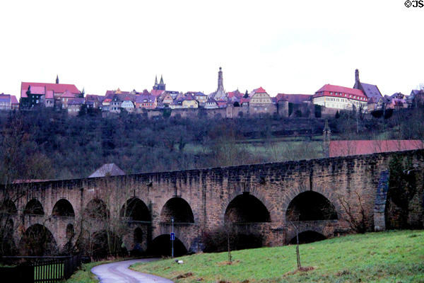 Town (1170) overview taken from Doppelbrucke (double level bridge) crossing Tauber River. Rothenburg ob der Tauber, Germany.