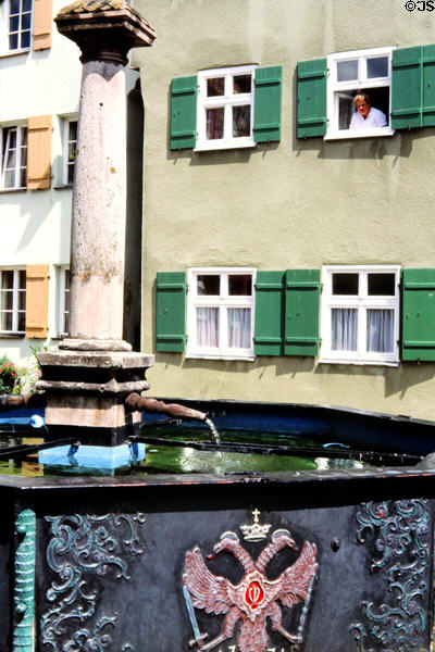 Fountain with double headed eagle & crown on the side. Dinkelsbühl, Germany.