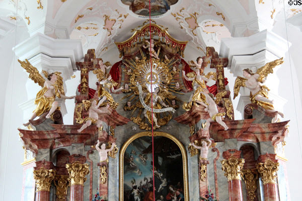 Sunburst surrounded by cherubs above altar representing "Gloria in Excelsis Deo" in Liebfrauenkirche. Günzburg, Germany.