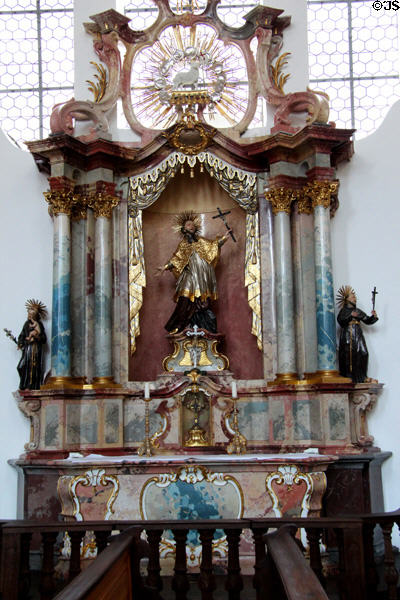 Side altar dedicated to St Francix Xavier surmounted by the Lamb of God, a common symbol for Jesus, at Liebfrauenkirche. Günzburg, Germany.
