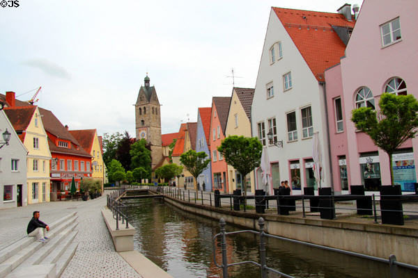 View along Hirschgasse canal looking to tower of Lutheran church of Our Lady. Memmingen, Germany.