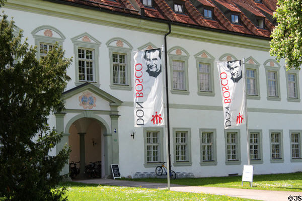 Entrance with banners of Salesians of Don Bosco who now dwell in Benediktbeuern Abbey. Germany.