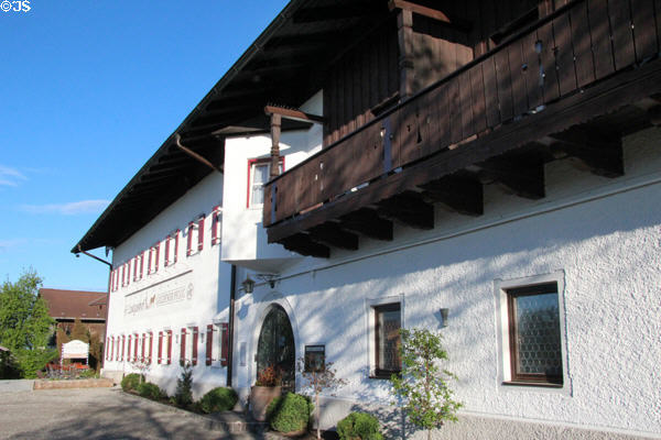 Typical wooden balcony on small hotel in Chiemsee region. Chiemsee, Germany.