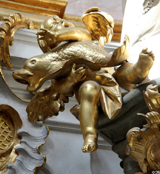 Detail of cherub holding dolphin at Ettal Benedictine Abbey. Ettal village, Germany.