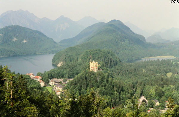 View of Hohenschwangau Castle over Schwangau town & Alpsee seen from Neuschwanstein Castle. Füssen, Germany.